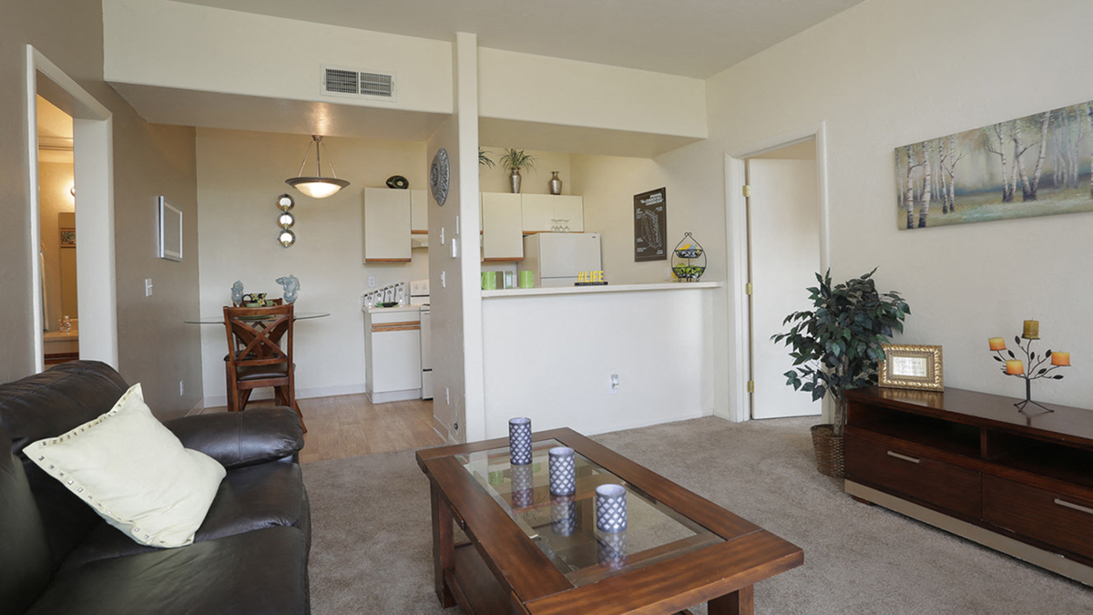 Springhill living room with carpet flooring and comfy couches